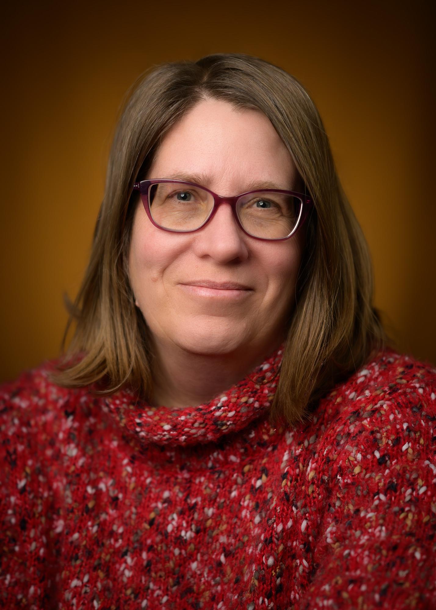 A headshot of a women